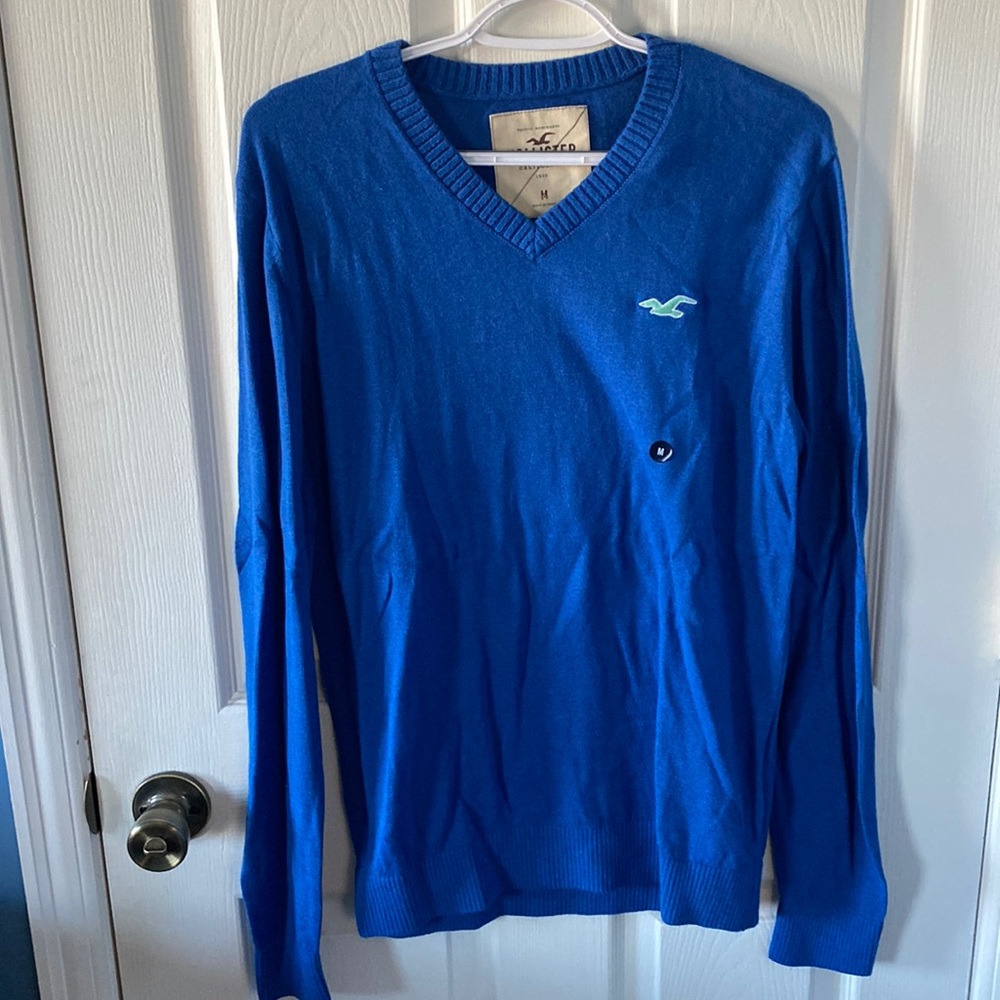 New, never worn with tags Hollister V-neck sweater.